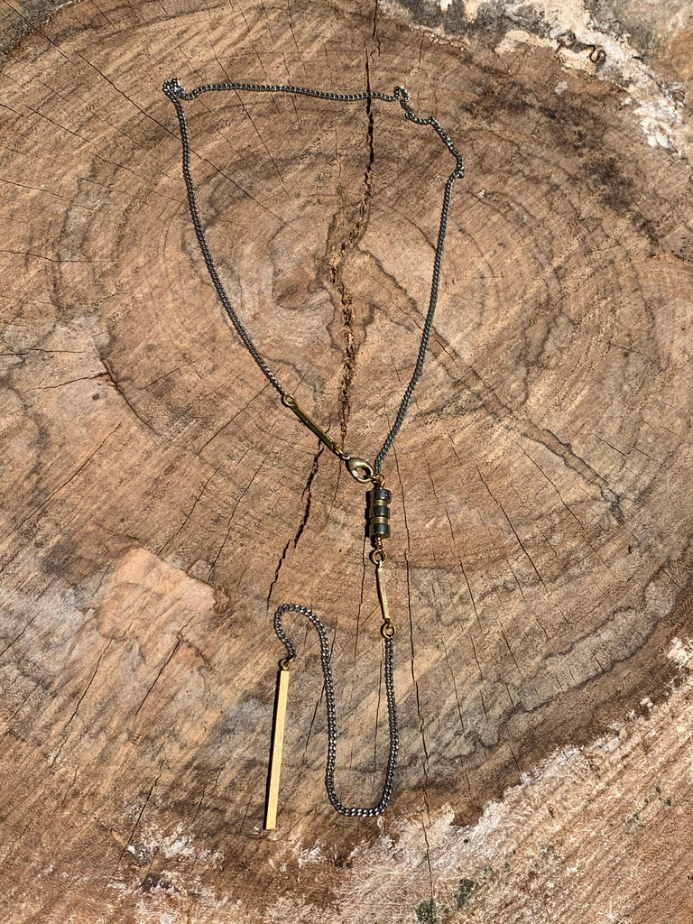 Silver curb link chain with pyrite and brass bar detail