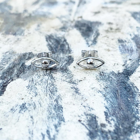 Sterling Silver Evil Eye Studs with lashes. 18k rose gold plated, blue cubic zirconia