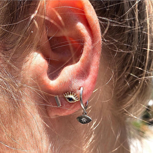 Sterling Silver Evil Eye Studs with lashes. 18k rose gold plated, blue cubic zirconia