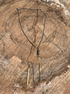 Silver curb link chain with pyrite and brass bar detail